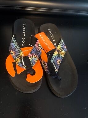Rocket Dog Black Flip Flops with Rainbow Tie-Dye Straps